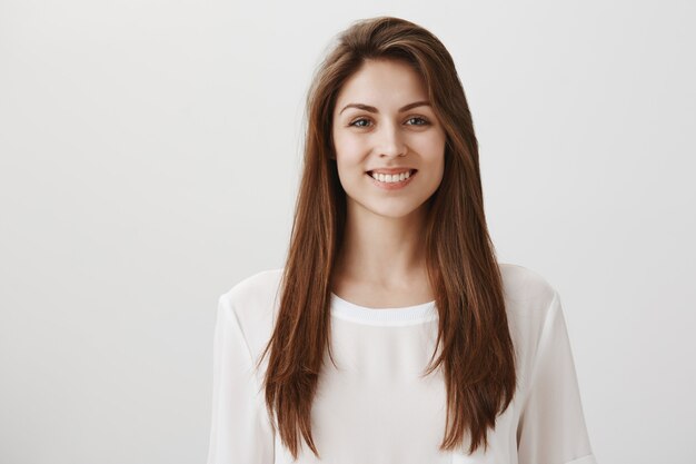 files/smiling-happy-woman-standing-white-casual-t-shirt-grey_176420-20793_b0dbd785-c9b6-4d97-b74c-8a06a8a772cc.jpg
